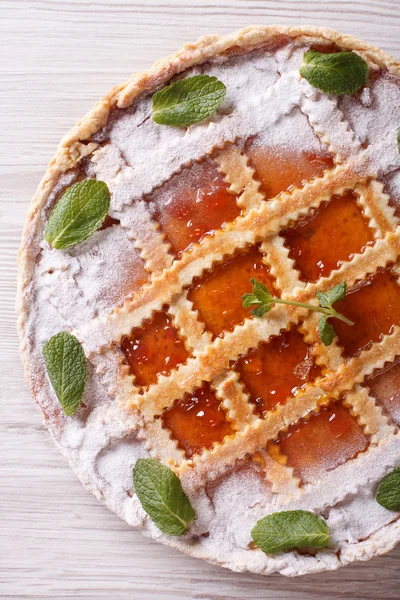 Italian tart with apricot jam close up vertical top view — Stock Photo, Image