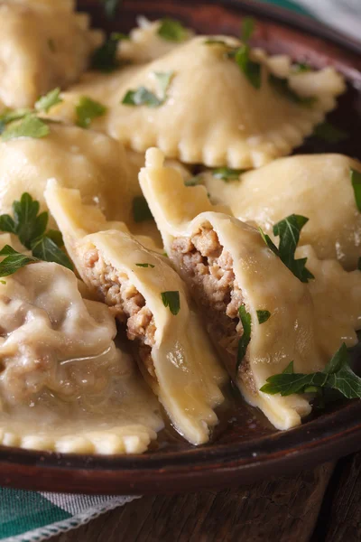 Italian ravioli with meat closeup on a brown plate. Vertical — Stock Photo, Image