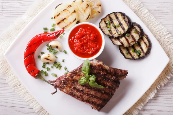 Beefsteak, grilled vegetables and sauce horizontal top view — Stock Photo, Image