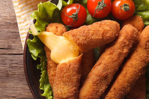 Hot fried cheese on a plate close-up horizontal top view — Stock Photo, Image