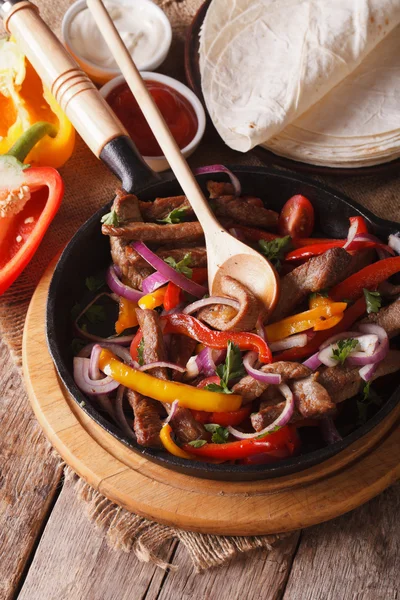 Fajitas close up and ingredients on the table vertical top view — Stock Photo, Image