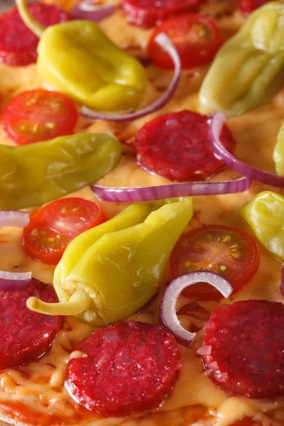 Pizza with salami, pepperoni pepper macro vertical — Stock Photo, Image