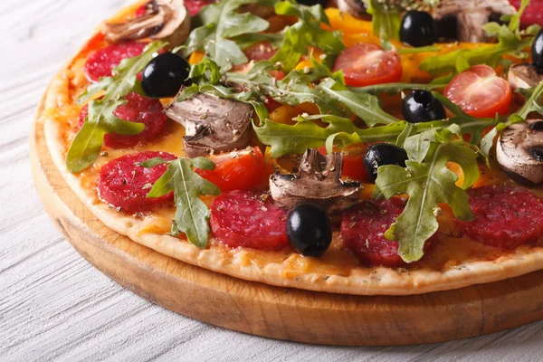 Delicious pizza with herbs, vegetables and salami horizontal — Stock Photo, Image