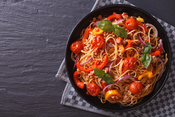 Beautiful spaghetti with minced meat and vegetables, top view