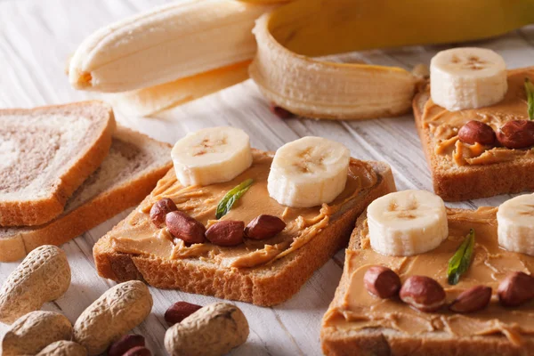 Funny sandwiches with peanut butter and banana horizontal — Stock Photo, Image
