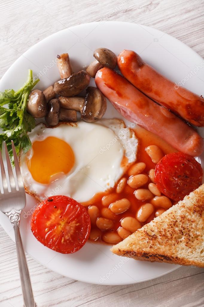 Traditional English breakfast closeup. vertical top view 