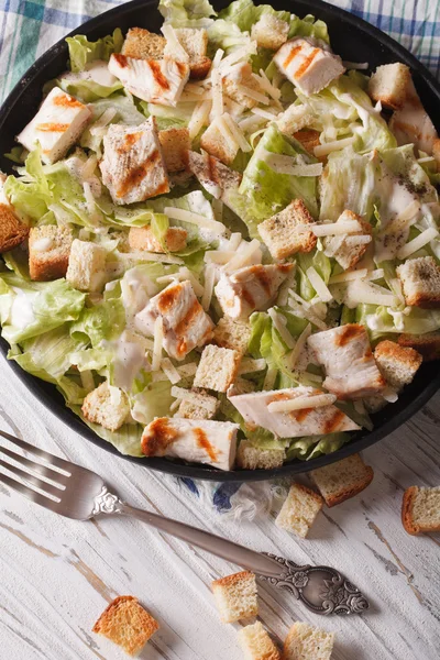 Caesar salad with grilled chicken. Vertical top view closeup — Stock Photo, Image