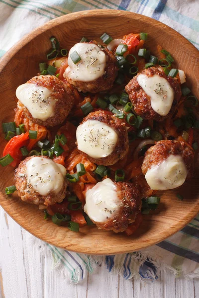 Meatballs with cheese in bowl closeup. vertical top view — Stock Photo, Image