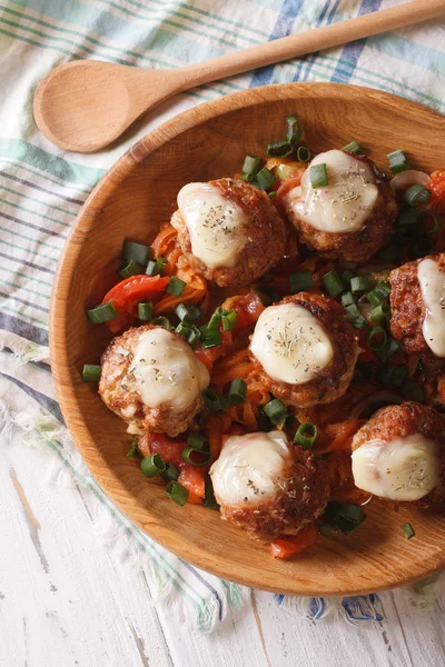 Meatballs baked with cheese close up vertical top view — Stock Photo, Image