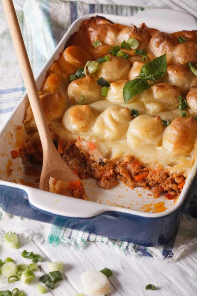 Cottage pie in the baking dish closeup. vertical — Stock Photo, Image