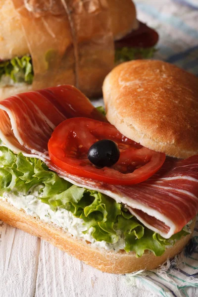 Sandwich with jamon, cheese and vegetables closeup vertical — Stock Photo, Image