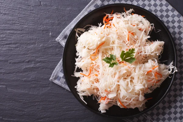 Homemade sauerkraut with carrot horizontal top view — Stock Image Homemade sauerkraut with carrot horizontal top view Royalty Free Stock Photos