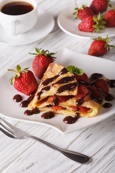 Crepes with strawberries and coffee close-up. Vertical — Stock Photo, Image