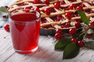 Delicious cherry juice and pie close-up. Horizontal clipart