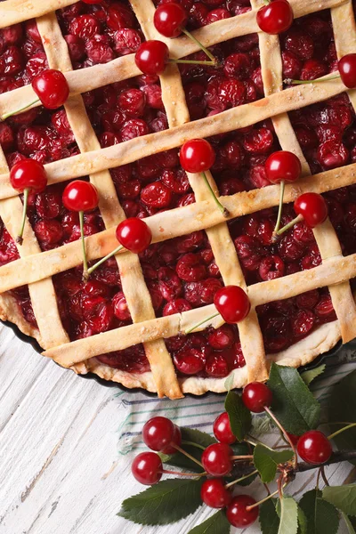 Cherry pie and ripe berries close-up vertical top view — Stock Photo, Image