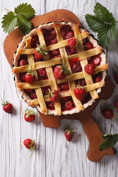 homemade strawberry tart in a baking dish vertical top view