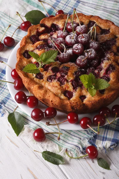 Rustic cherry pie close up on a plate on the table. vertical — Stock Photo, Image