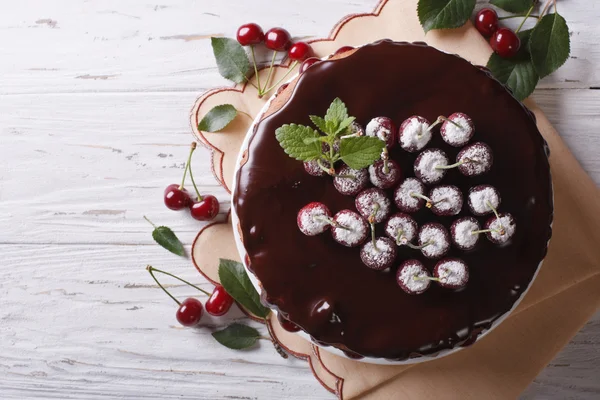 Delicious chocolate cherry cake on the table. Horizontal top vie — Stock Photo, Image