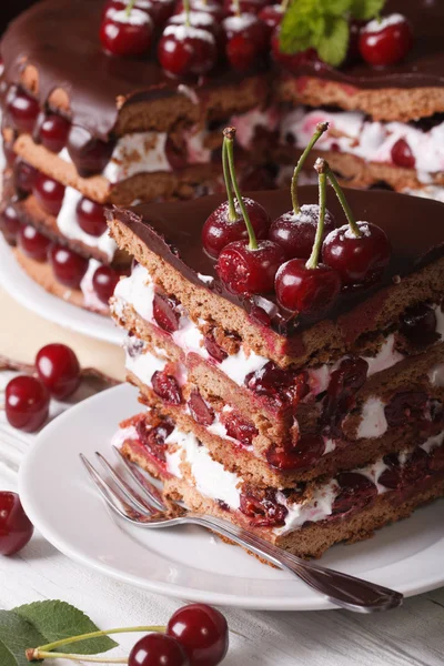 Sliced cherry cake with chocolate and cream close-up — Stock Photo, Image