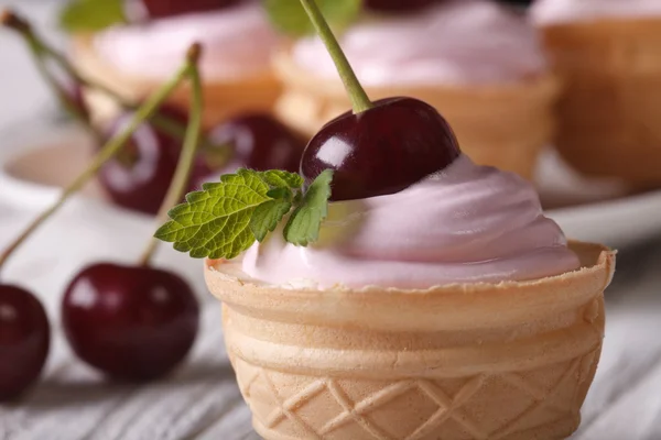 Tartlet with pink cream and cherries macro. horizontal — Stock Photo, Image