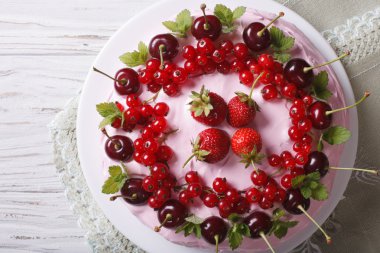 cake with cherries, currants and strawberries close-up