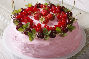 Pink berry cake on a plate closeup. horizontal