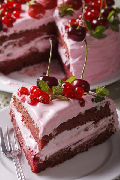 Slice of homemade berry cake on a plate closeup. vertical — Stok fotoğraf
