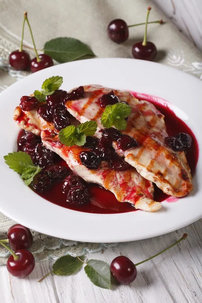 Grilled chicken with cherry sauce and mint close up. Vertical — Stok fotoğraf