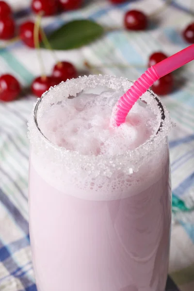 Whipped cherry milkshake in a glass macro. vertical — Stock fotografie