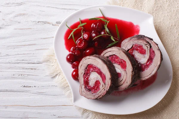 Beef roll stuffed with cherries close-up horizontal top view — Stock Photo, Image