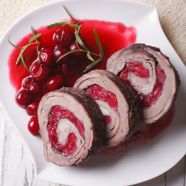 Meat stuffed with cherries close-up. view from above — Stock Photo, Image