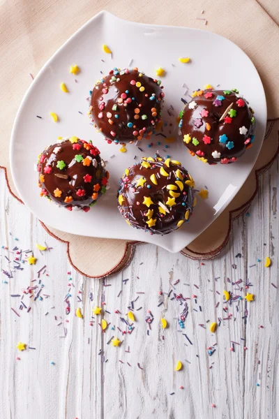 Chocolate apples with sprinkles candy. vertical top view — Stock Photo, Image