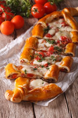 Sliced Turkish pide close up and ingredients. vertical top view