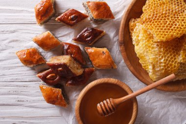 Delicious baklava and honey close-up on a table horizontal top v