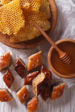 baklava and honey close-up on a table vertical view from above