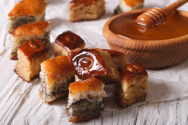 Baklava Honey with poppy seeds and nuts close-up. horizontal — Zdjęcie stockowe