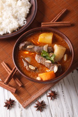  traditional Thai beef massaman curry close-up. vertical top vie