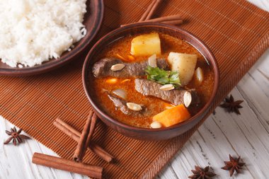 Thai beef massaman curry with peanuts and rice side dish