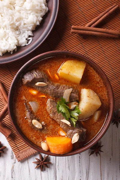 Thai beef massaman curry and rice side dish closeup. vertical to — Stock Image Thai beef massaman curry and rice side dish closeup. vertical to Stock Image