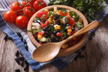 vegetable salad with black beans and ingredients table. Horizont clipart