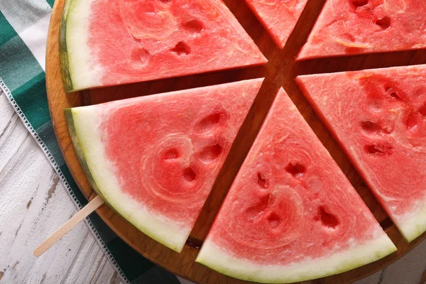 Slices of watermelon on a stick macro. Horizontal top view — Stock Photo, Image