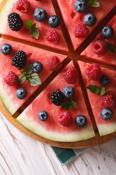 Sliced watermelon with berries and mint close-up. Vertical top v — Stock Photo, Image