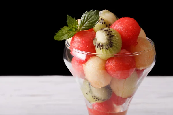 Salad with watermelon, kiwi and melon. horizontal on dark backgr — Stock Photo, Image