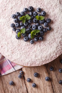 Delicious blueberry cheesecake with coconut close-up. vertical t