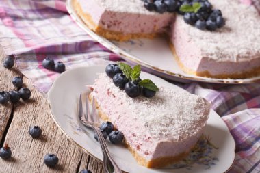 Homemade blueberry cheesecake with fresh berries closeup. horizo