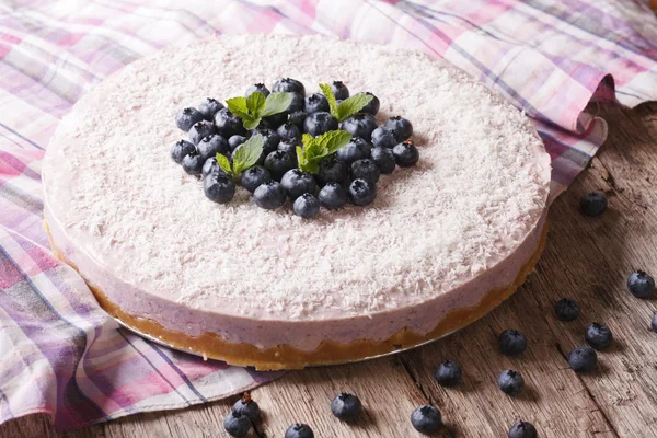 cheesecake with blueberries and mint close-up. horizontal