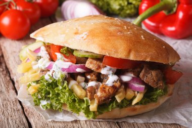 Appetizing sandwich: Doner kebab close-up on the table. horizont clipart