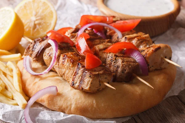 Greek souvlaki kebab with pita bread macro. horizontal — Stock Fotó