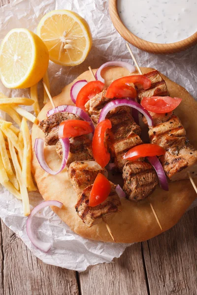 Greek souvlaki with pita close-up. vertical view from above — Zdjęcie stockowe