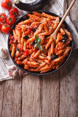 Italian food: Pasta alla Norma and ingredients. vertical top vie